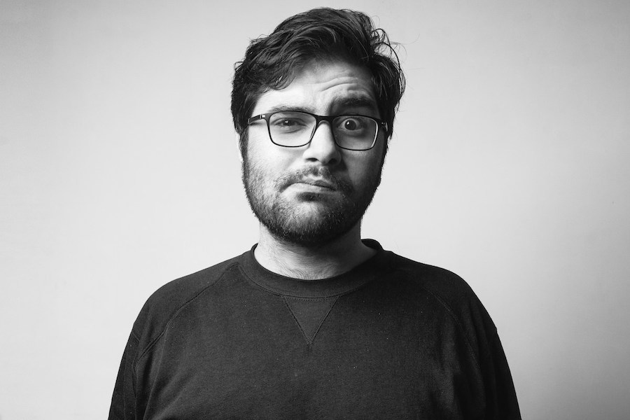 Taxes: A Very Long List. A black and white image of a man with an incredulous look.