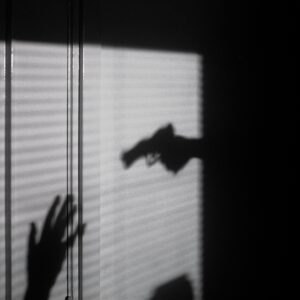 The Government has refused to extend the deadline for death duties on pensions. Shadow image of a gun and a person holding up their hands in surrender. You need to focus on estate planning like never before